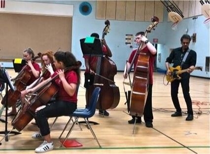 Abaad playing 'Back in Black' with the Franklin MS band