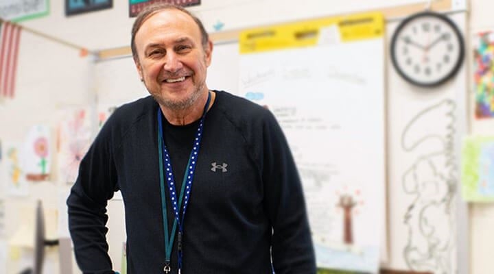 Caucasian Teacher standing smiling