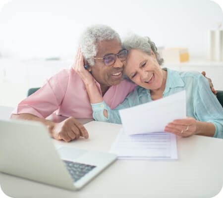 A happy couple looking at a document together