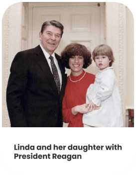 Linda and her daughter with President Reagan