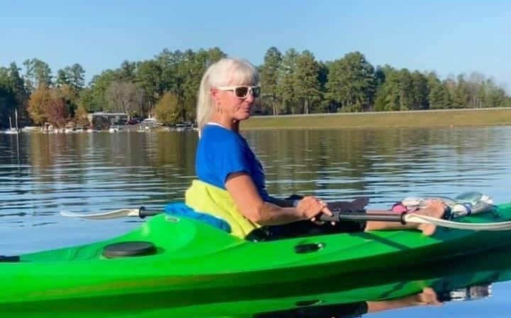 Debi Sorber kayaking on lake Monticello