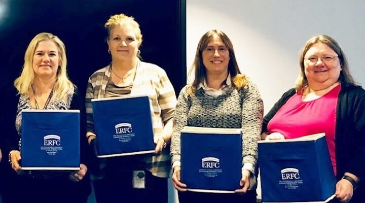 ERFC Ambassadors holding blue boxes